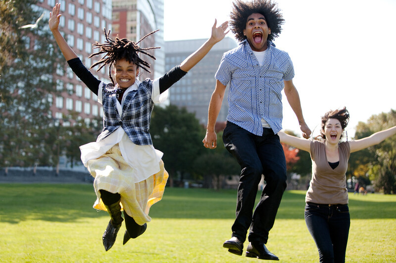 Young People Jumping For Joy