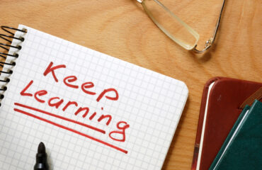 Notepad With The Phrase "Keep Learning"