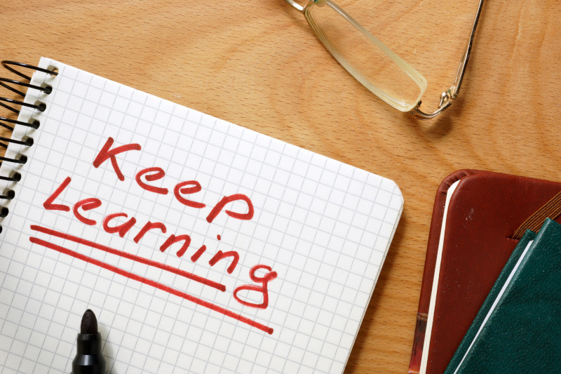 Notepad With The Phrase "Keep Learning"