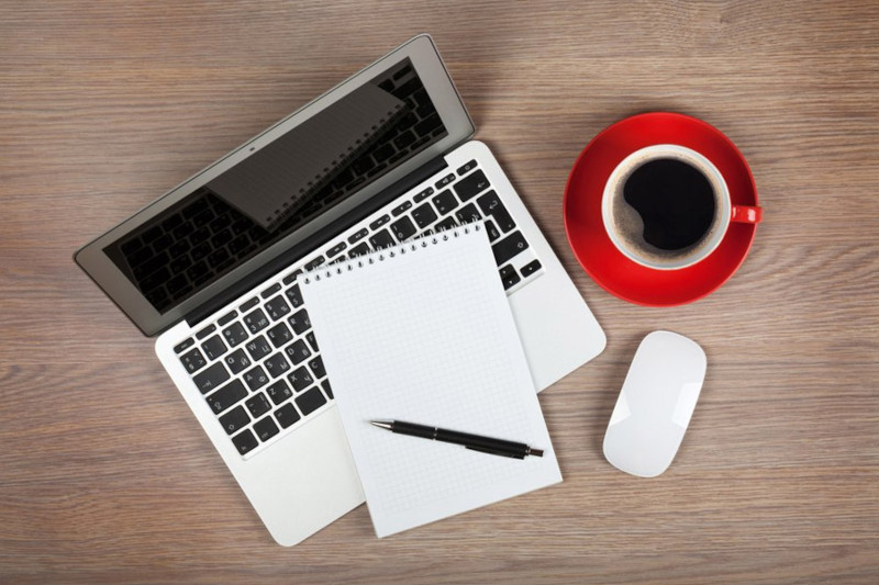 Laptop, Notepad and Pen Next To Cup Of Coffee