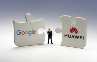 Google-Huawei Jigsaw Puzzle Pieces Side by Side With Man in Middle