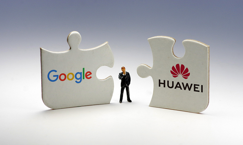 Google-Huawei Jigsaw Puzzle Pieces Side by Side With Man in Middle