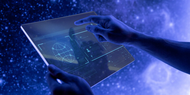 Hands using a transparent futuristic digital tablet screen