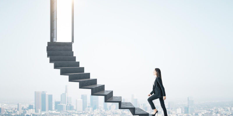 Businesswoman walking on ladder to success with megapolis city backdrop