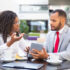 Businessman showing project presentation to female client