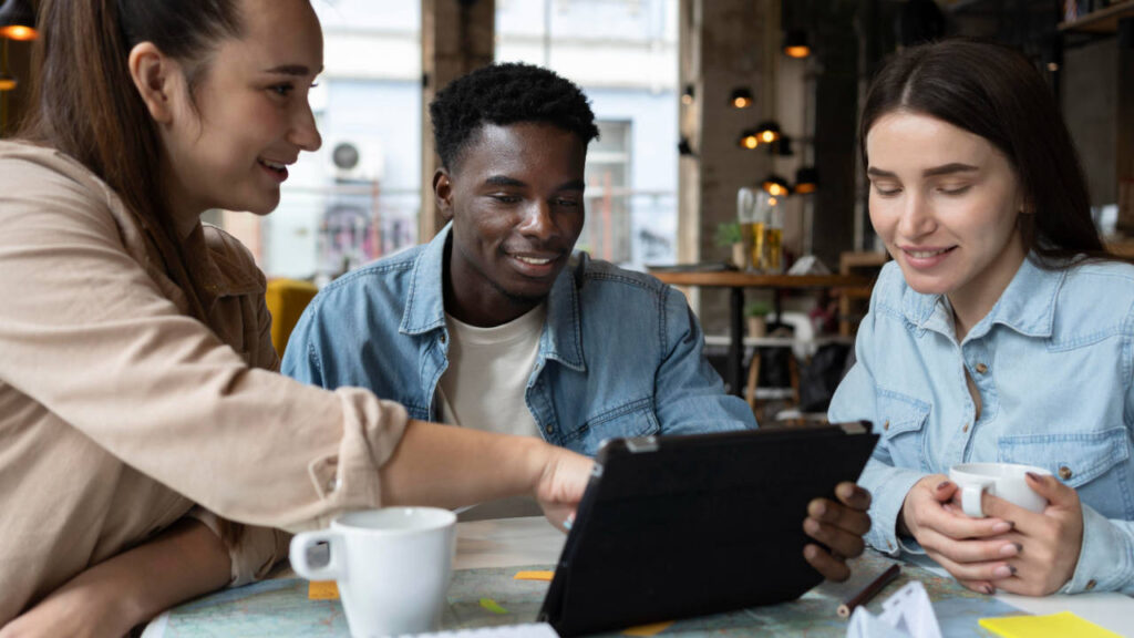 Business people discussing a project whilst looking at a tablet