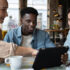 Business people discussing a project whilst looking at a tablet