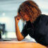 A demotivated businesswoman sitting at her desk